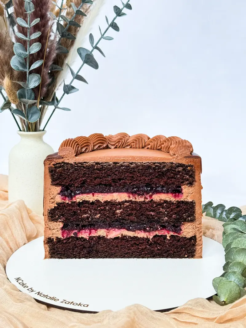 section of chocolate cake with cherry Active Image