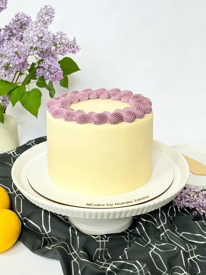 whole poppy lemon cake on the cake board Active Image
