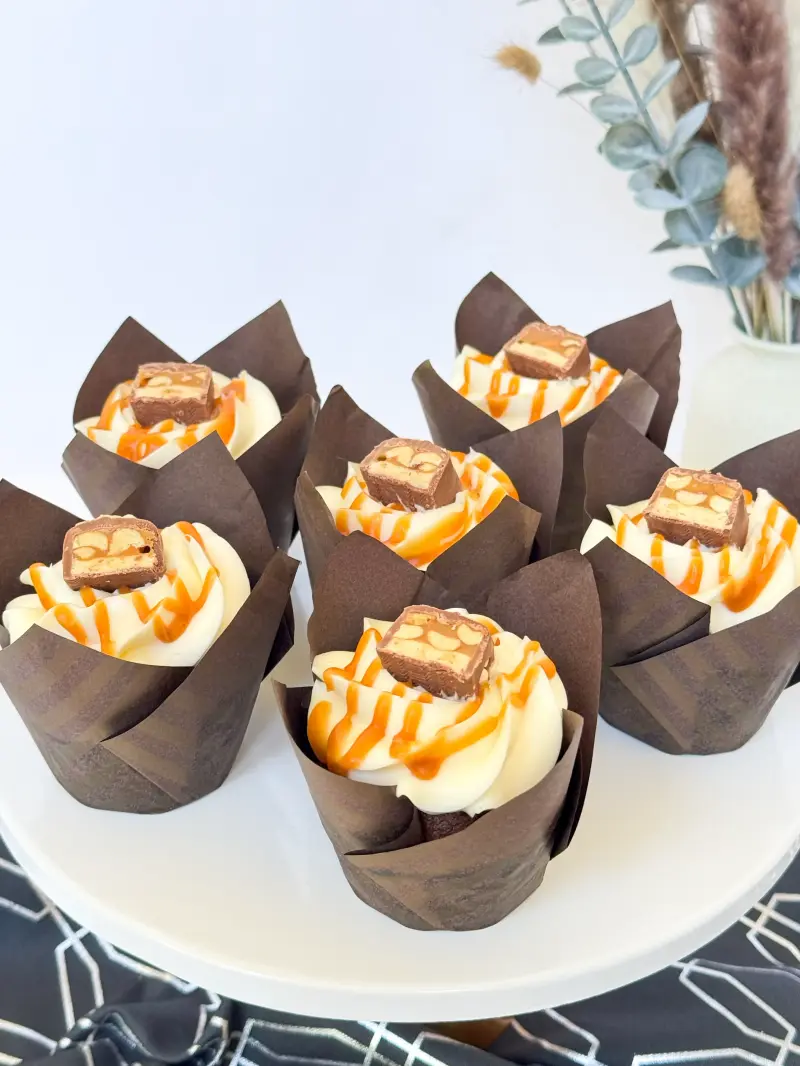 Chocolate cupcakes with caramel and peanut Active Image