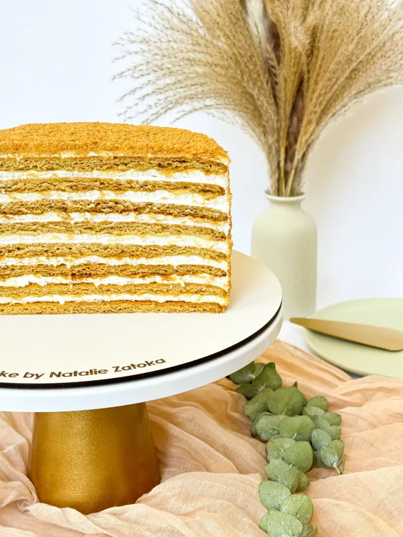 half of honey cake on the cake stand Active Image