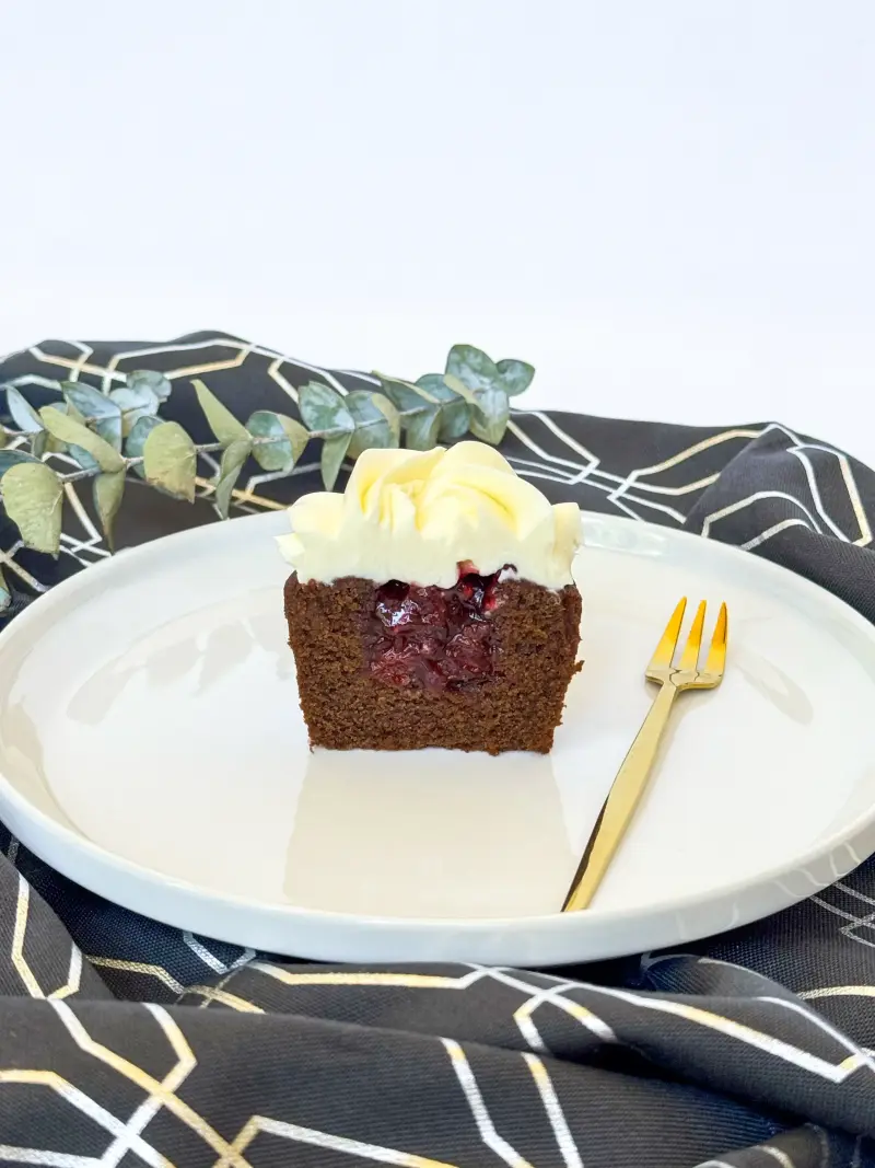 cut inside of chocolate cherry cupcake Active Image