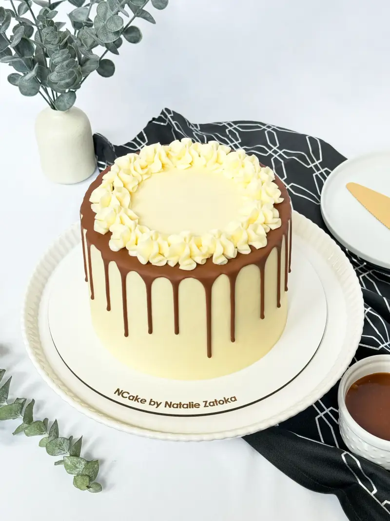 whole cake snickers on the cake stand Active Image