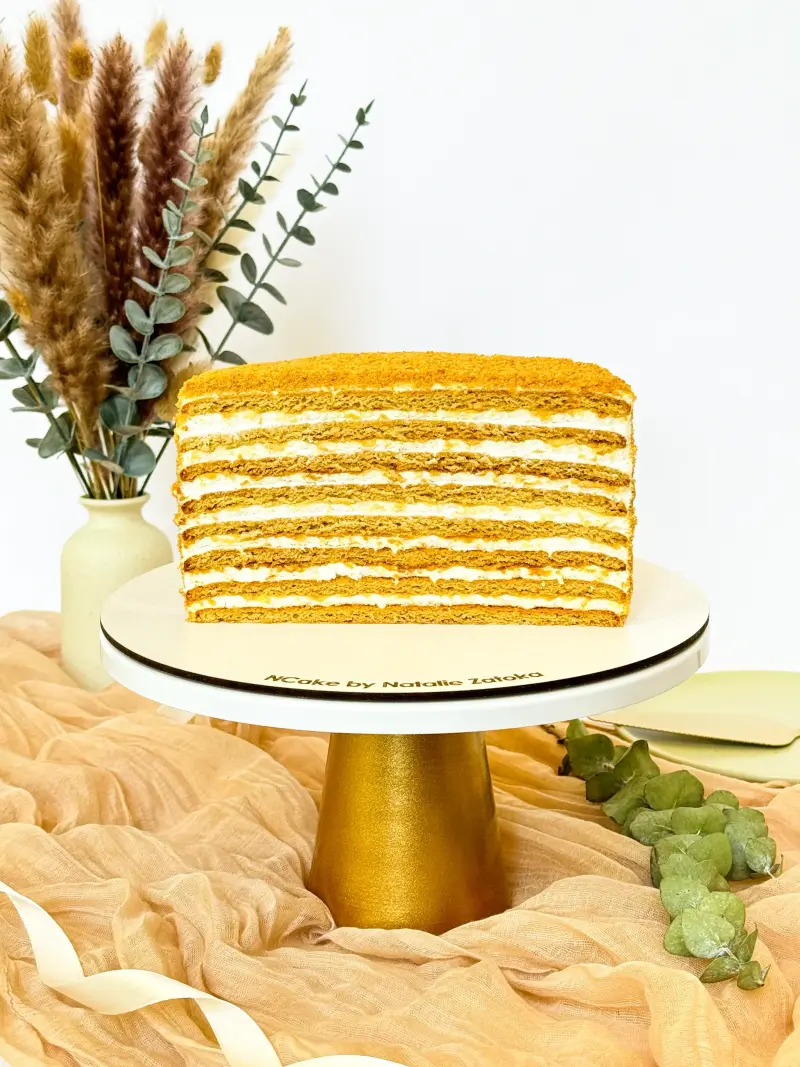 half of honey cake on the cake stand Active Image