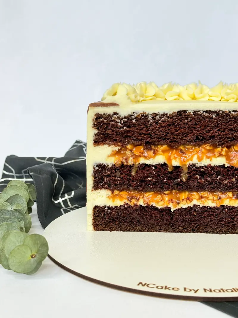 half of snickers cake on the cake board Active Image