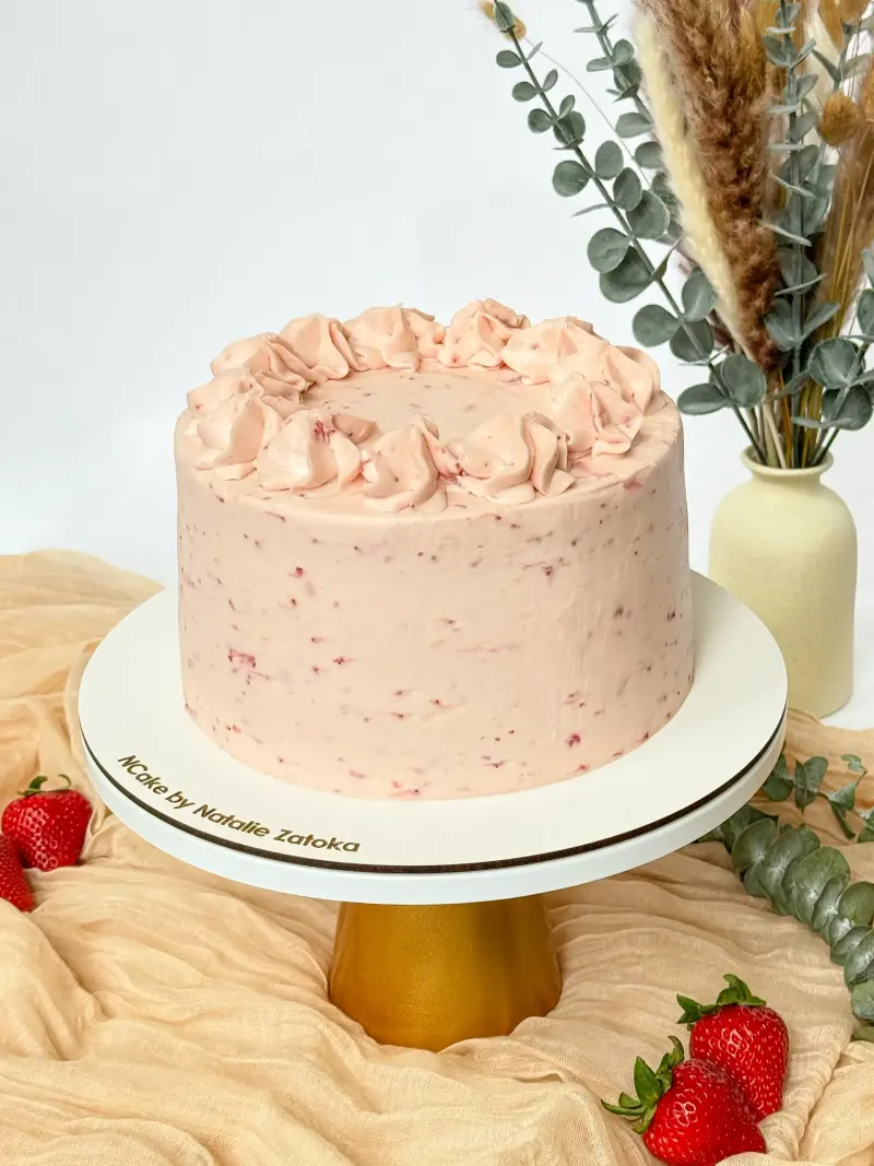 whole vanilla strawberry cake on the cake stand Active Image