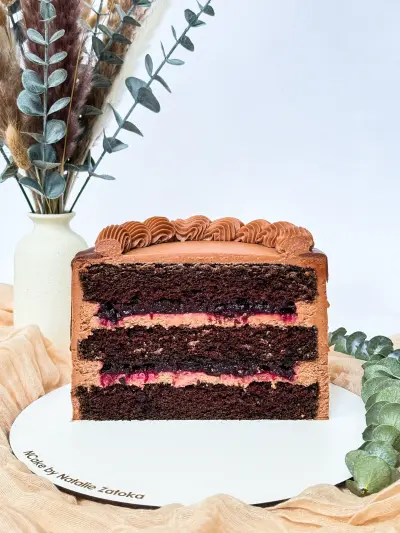 section of chocolate cake with cherry 48