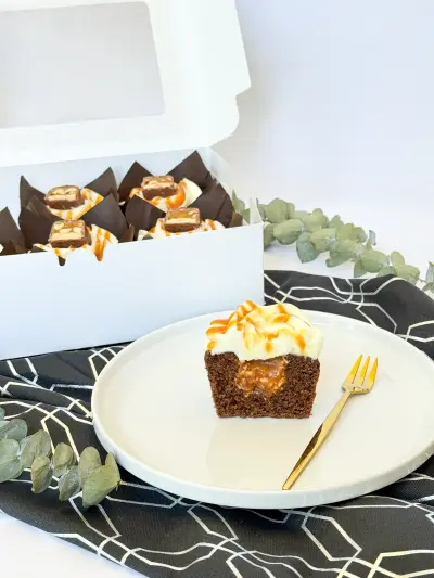 Chocolate cupcakes with caramel and peanut in the box 157