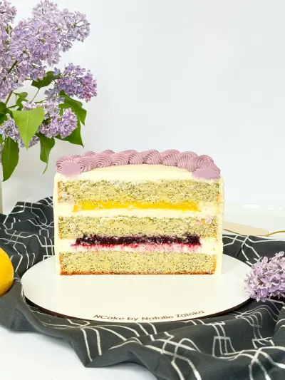 half of poppy lemon cake on the cake board 82