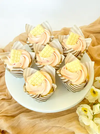 vanilla strawberry cupcakes on the stand 145