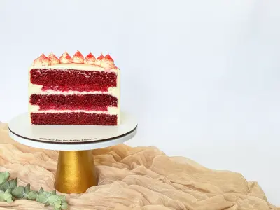 half of red velvet cake on the cake stand